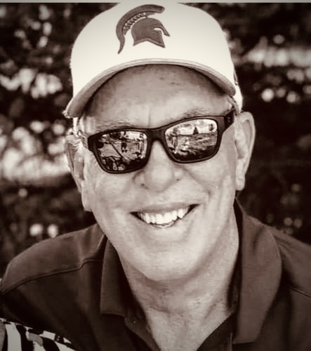 A person wearing a hat and sunglasses

Description automatically generated